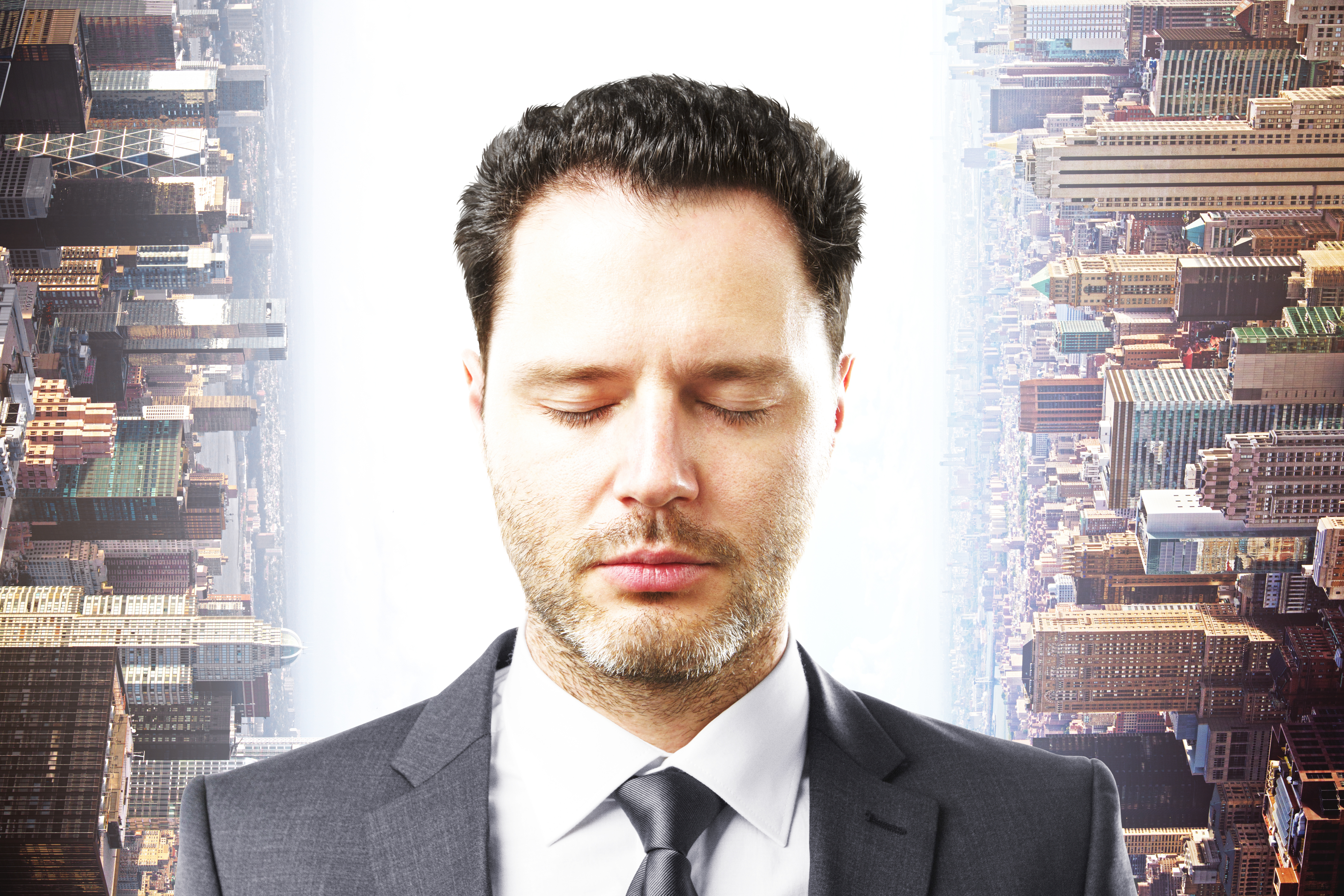 Busy professional practicing calm breathing with eyes closed